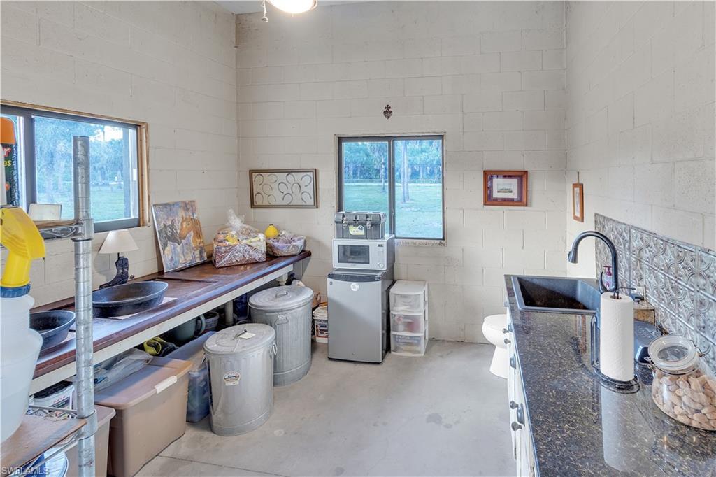 14600 Fritchey Road Naples, FL 34114 - Photo 39 of 44 a living room with furniture and window