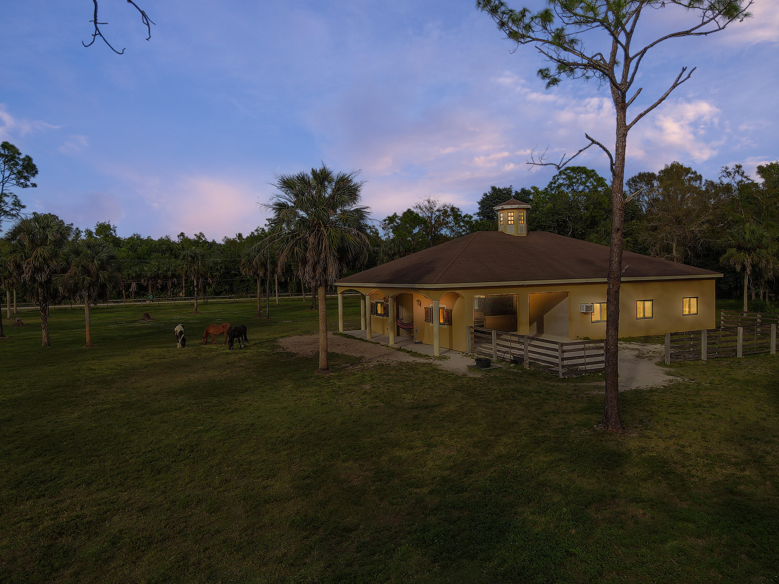 14600 Fritchey Road Naples, FL 34114 - Photo 40 of 44 a front view of a house with garden
