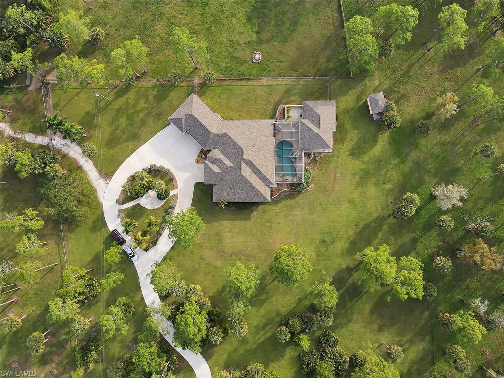 14600 Fritchey Road Naples, FL 34114 - Photo 42 of 44 an aerial view of house with yard swimming pool and outdoor seating
