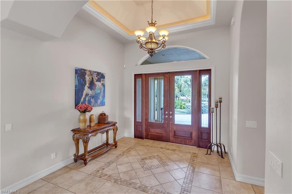 14600 Fritchey Road Naples, FL 34114 - Photo 5 of 44 a view of hall way with furniture and chandelier