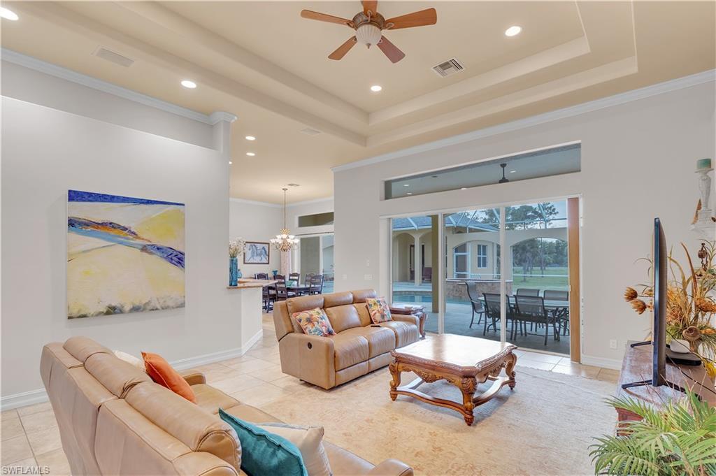 14600 Fritchey Road Naples, FL 34114 - Photo 7 of 44 a living room with furniture and a flat screen tv