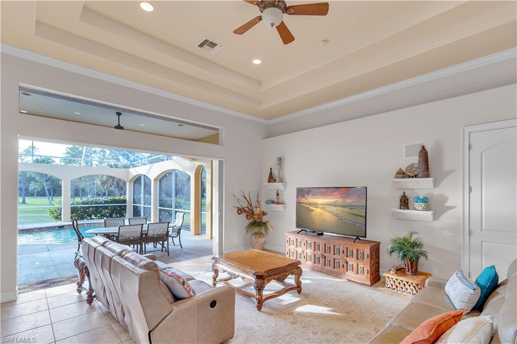 14600 Fritchey Road Naples, FL 34114 - Photo 8 of 44 a living room with furniture and a flat screen tv