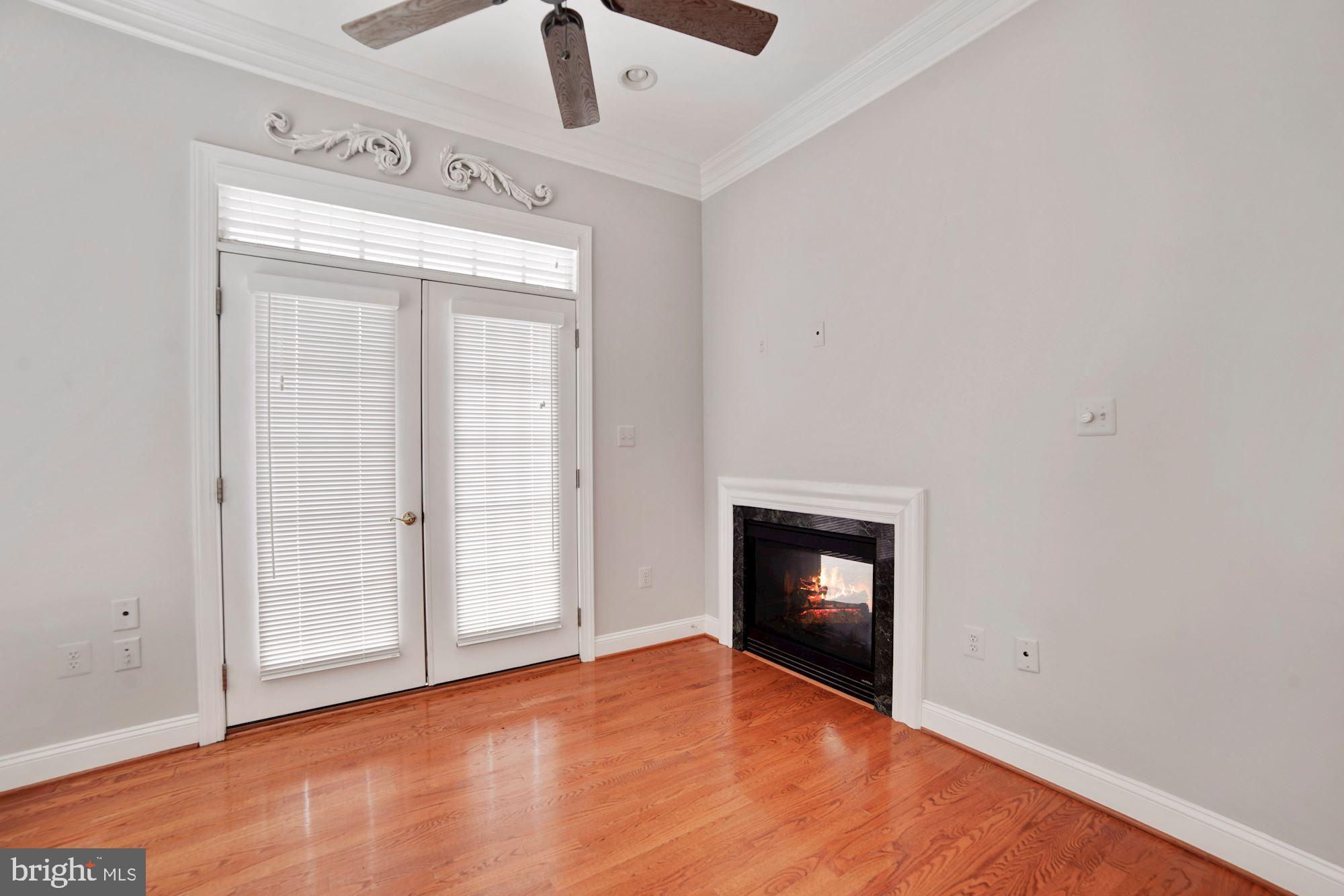 8238 Snead Loop Gainesville, VA 20155 - Photo 13 of 49 an empty room with wooden floor closet and windows