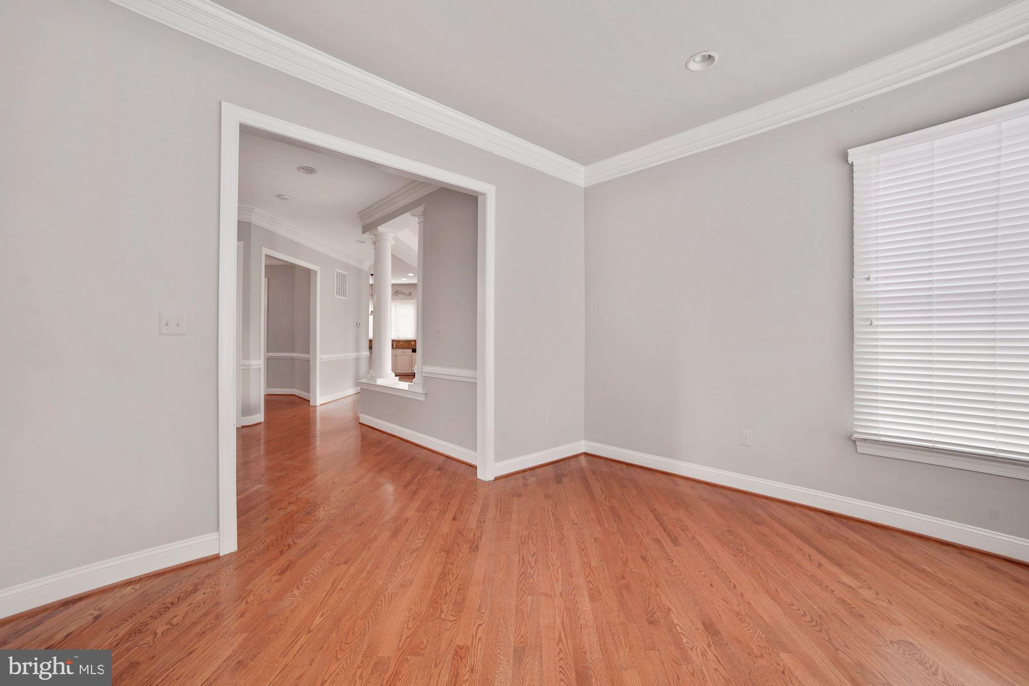 8238 Snead Loop Gainesville, VA 20155 - Photo 18 of 49 wooden floor in an empty room with a window