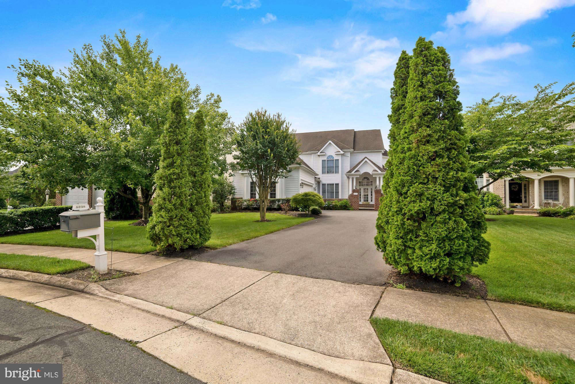 8238 Snead Loop Gainesville, VA 20155 - Photo 2 of 49 a pathway of a house with a yard