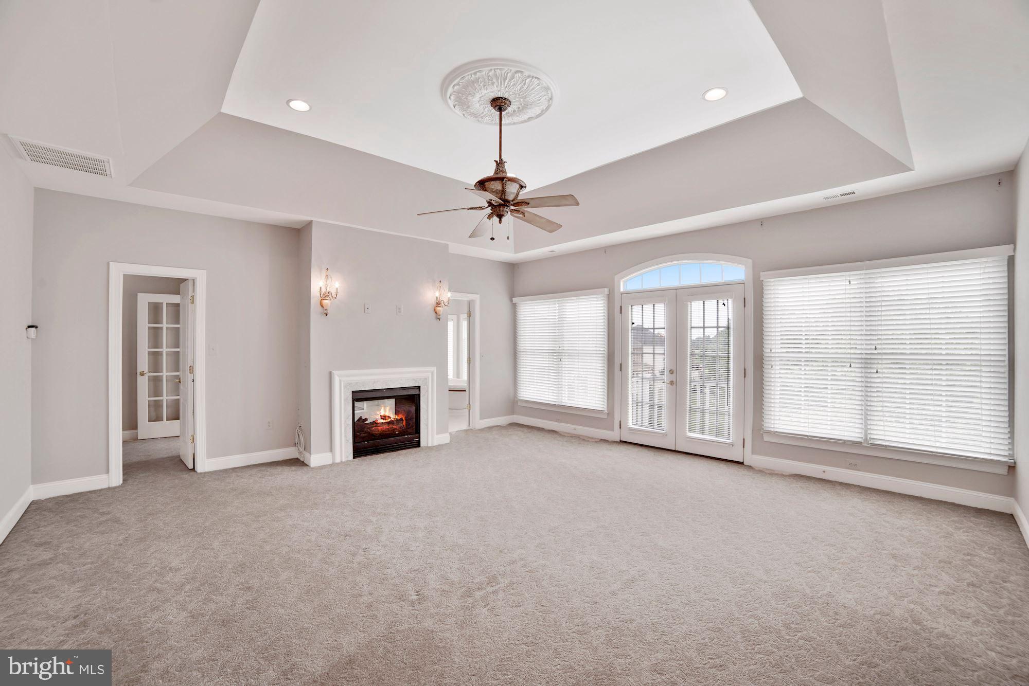 8238 Snead Loop Gainesville, VA 20155 - Photo 21 of 49 a view of a livingroom with a fireplace and window