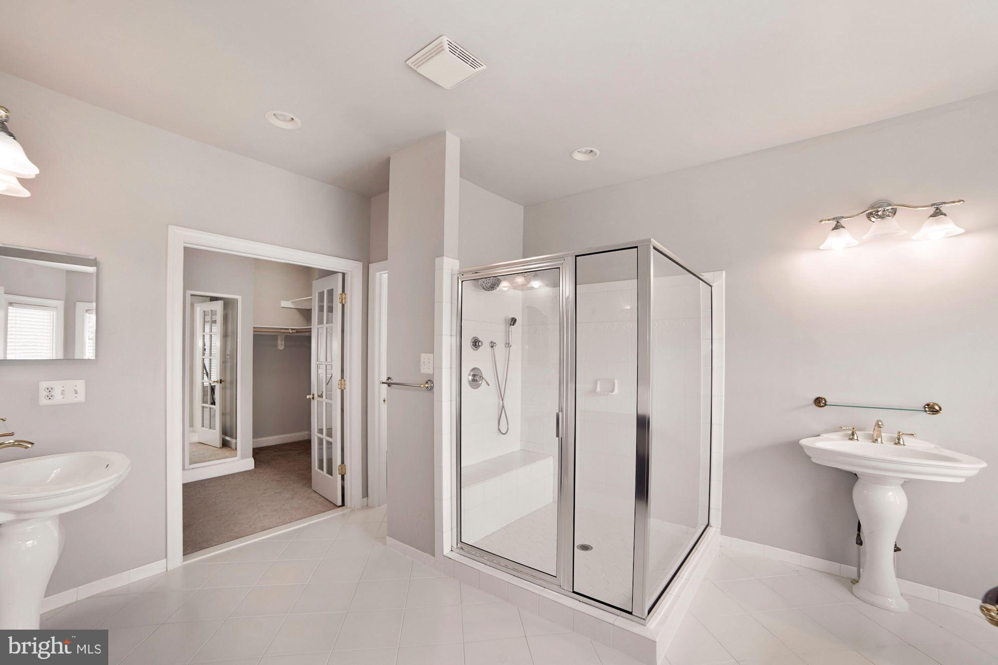 8238 Snead Loop Gainesville, VA 20155 - Photo 24 of 49 a bathroom with a sink a toilet and shower