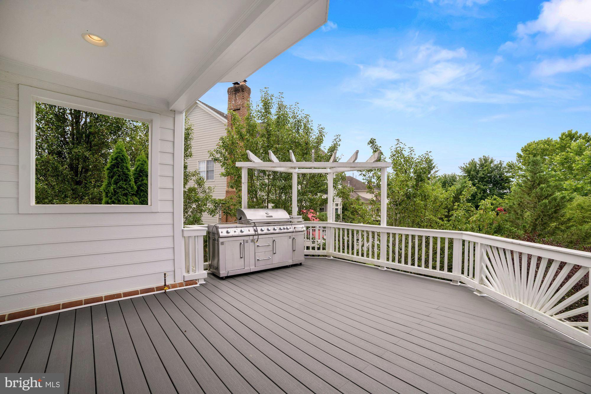 8238 Snead Loop Gainesville, VA 20155 - Photo 35 of 49 a view of roof deck with couches and wooden floor