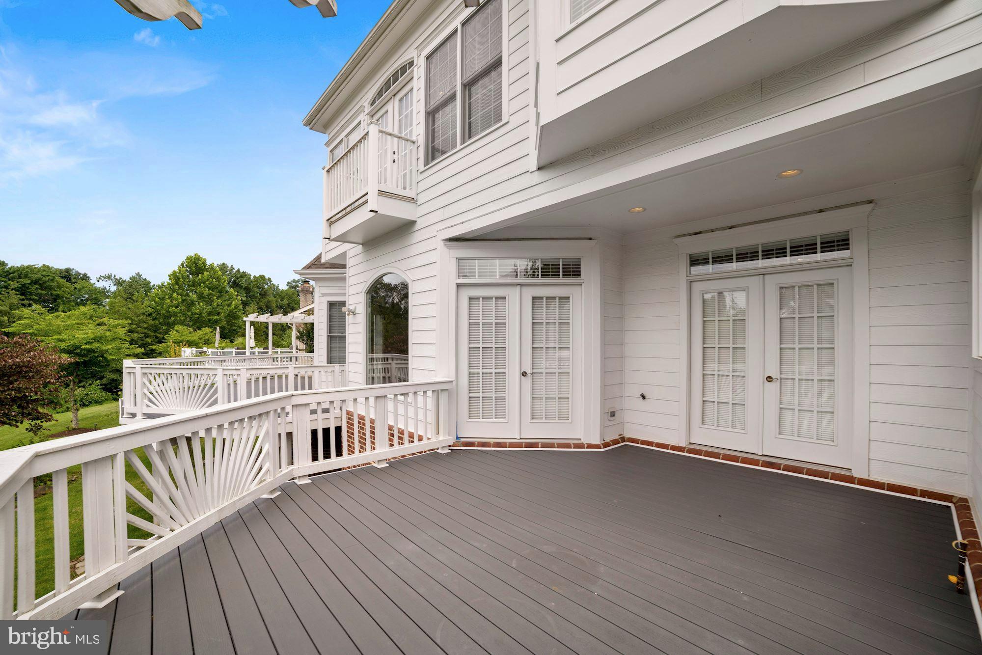 8238 Snead Loop Gainesville, VA 20155 - Photo 36 of 49 a view of a house with deck and wooden floor