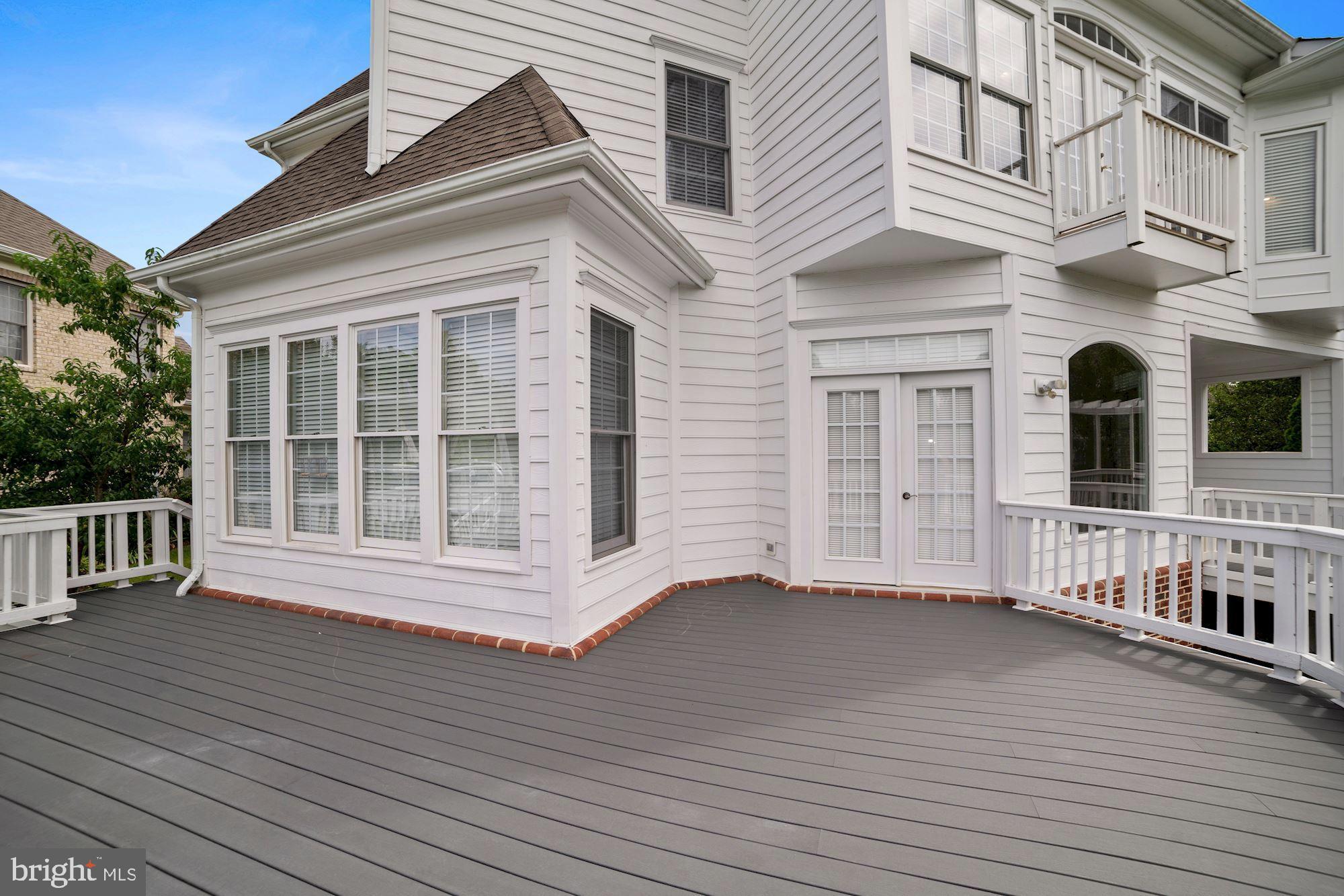 8238 Snead Loop Gainesville, VA 20155 - Photo 38 of 49 a view of a house with wooden deck