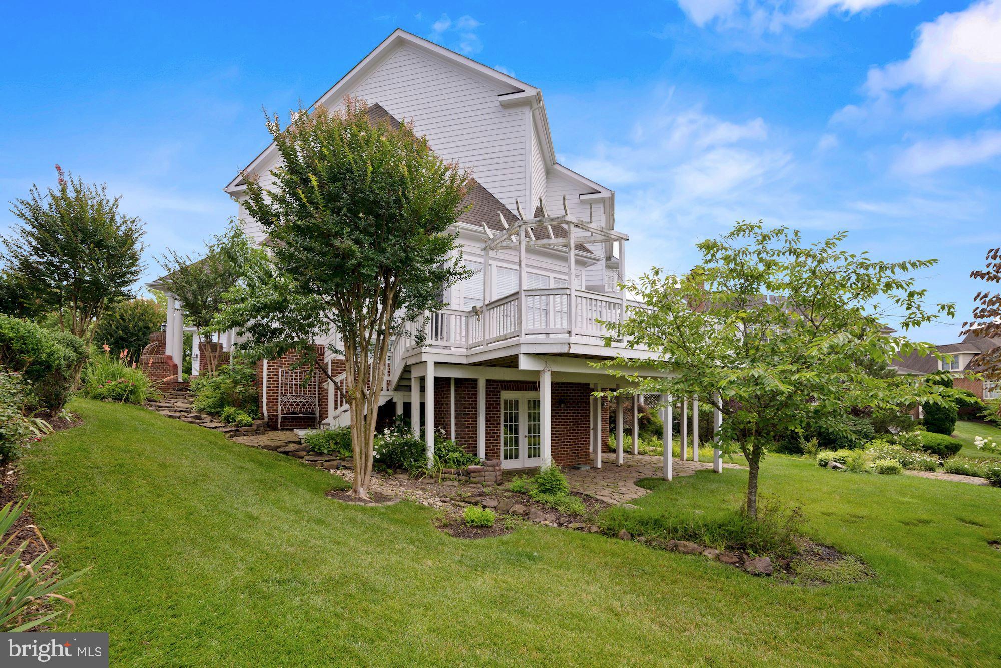 8238 Snead Loop Gainesville, VA 20155 - Photo 41 of 49 front view of a house with a yard