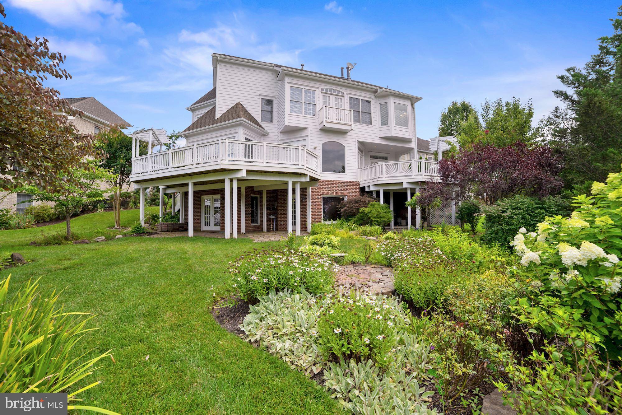 8238 Snead Loop Gainesville, VA 20155 - Photo 42 of 49 a front view of a house with a yard