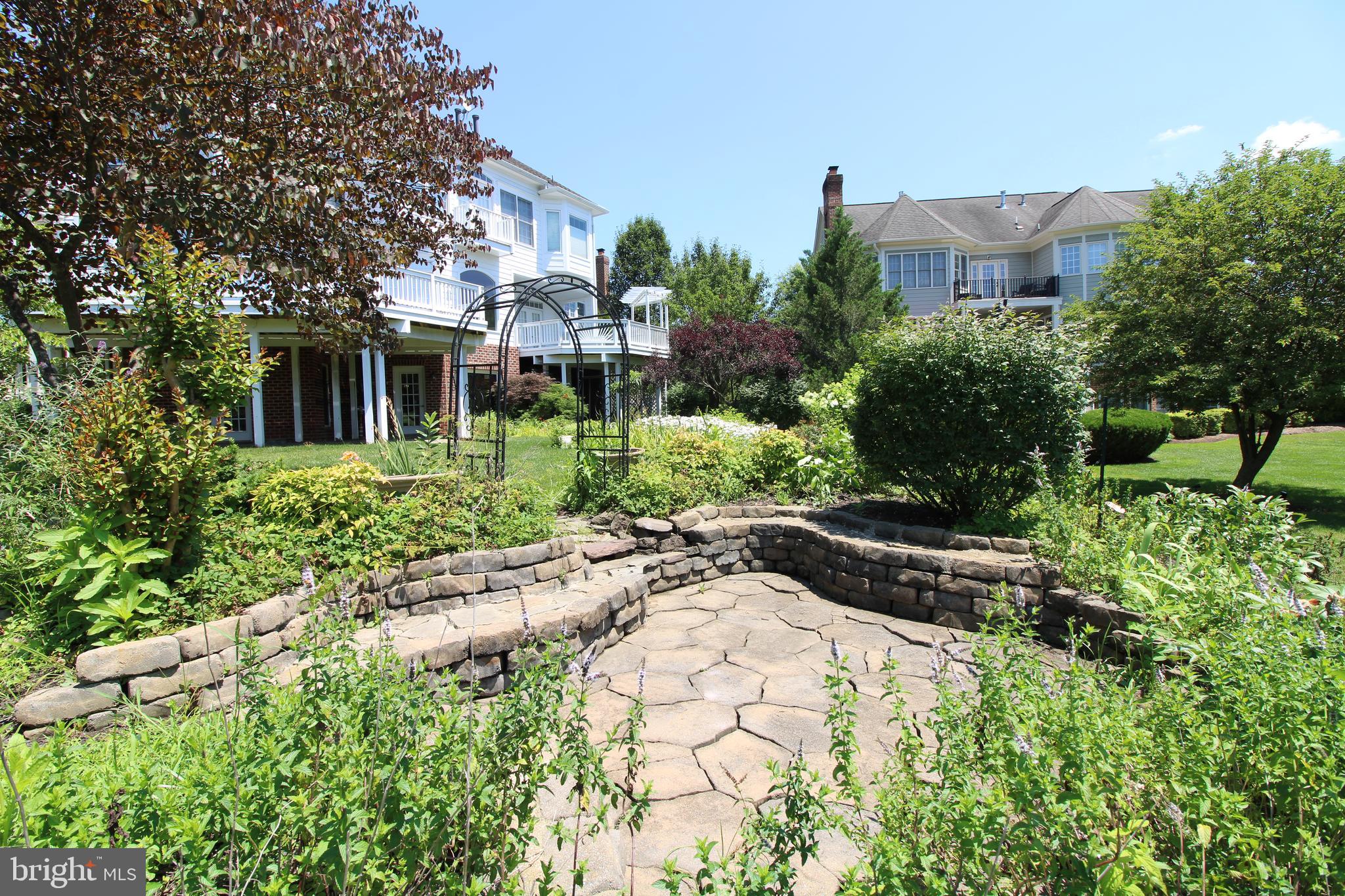 8238 Snead Loop Gainesville, VA 20155 - Photo 45 of 49 a view of a house with a yard and plant