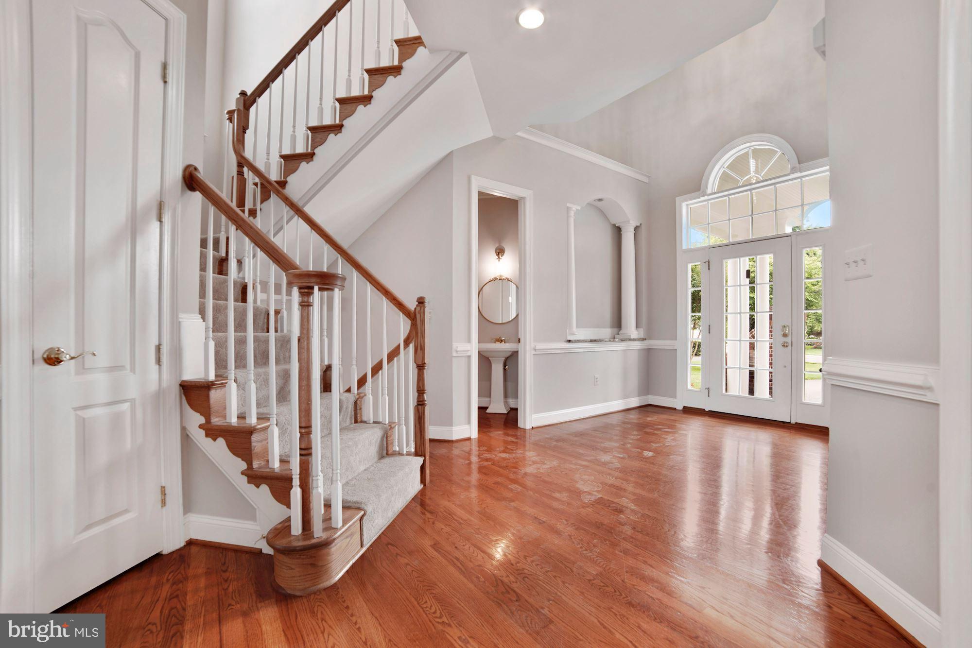 8238 Snead Loop Gainesville, VA 20155 - Photo 6 of 49 a view of an entryway with wooden floor