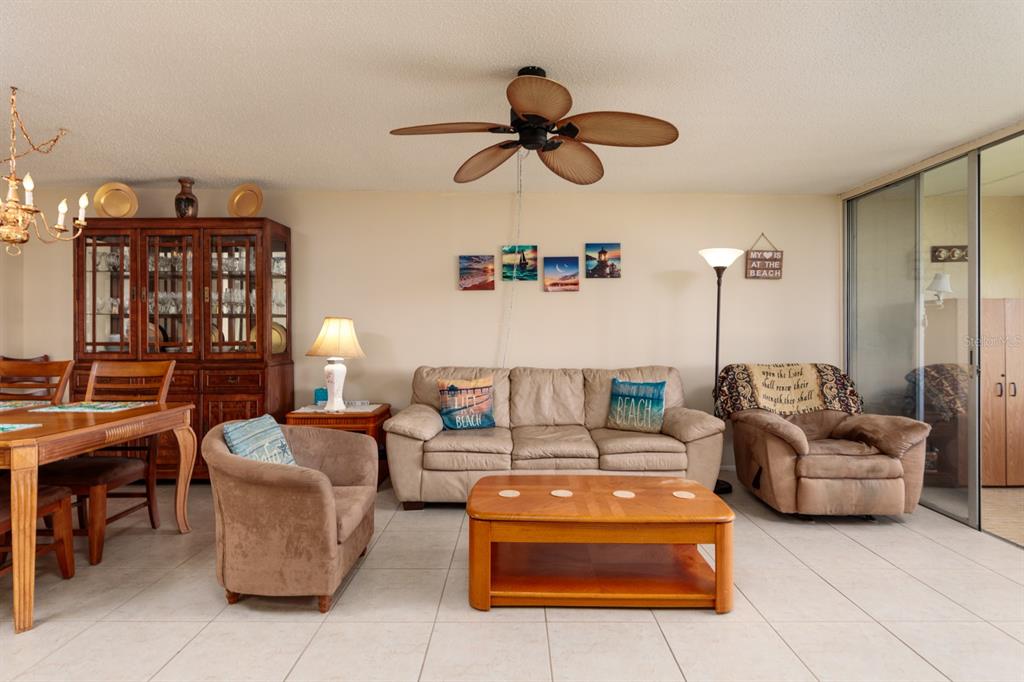 12300 Vonn Road, Unit 6303 Largo, FL 33774 - Photo 11 of 36 a living room with furniture and a ceiling fan