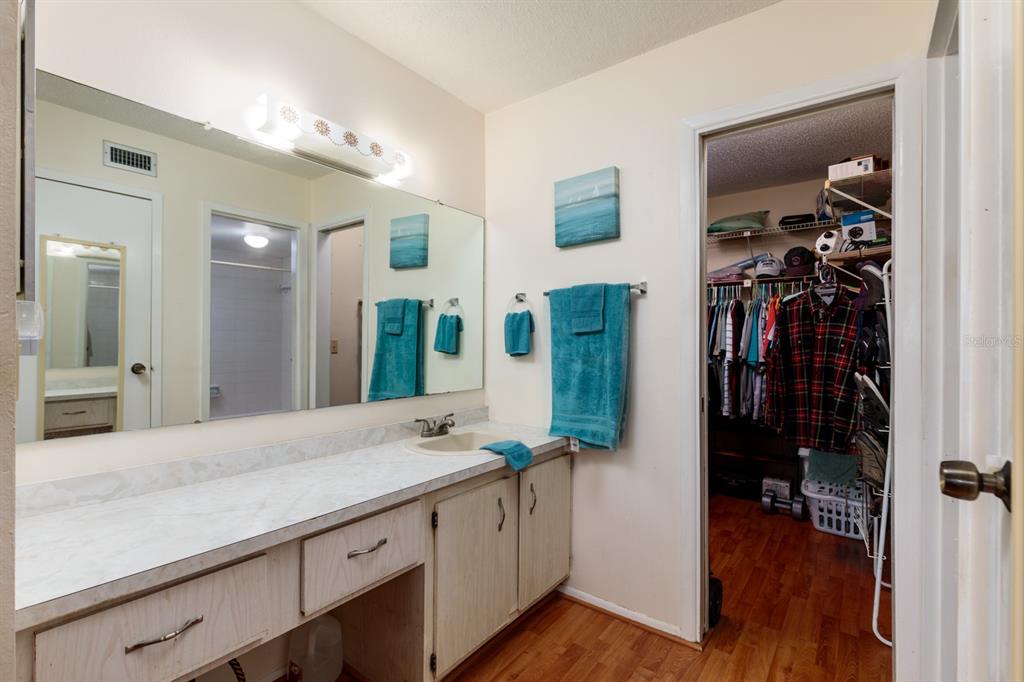 12300 Vonn Road, Unit 6303 Largo, FL 33774 - Photo 18 of 36 a bathroom with a sink and a mirror
