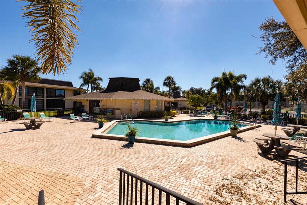 12300 Vonn Road, Unit 6303 Largo, FL 33774 - Photo 31 of 36 a view of swimming pool with outdoor seating and a patio