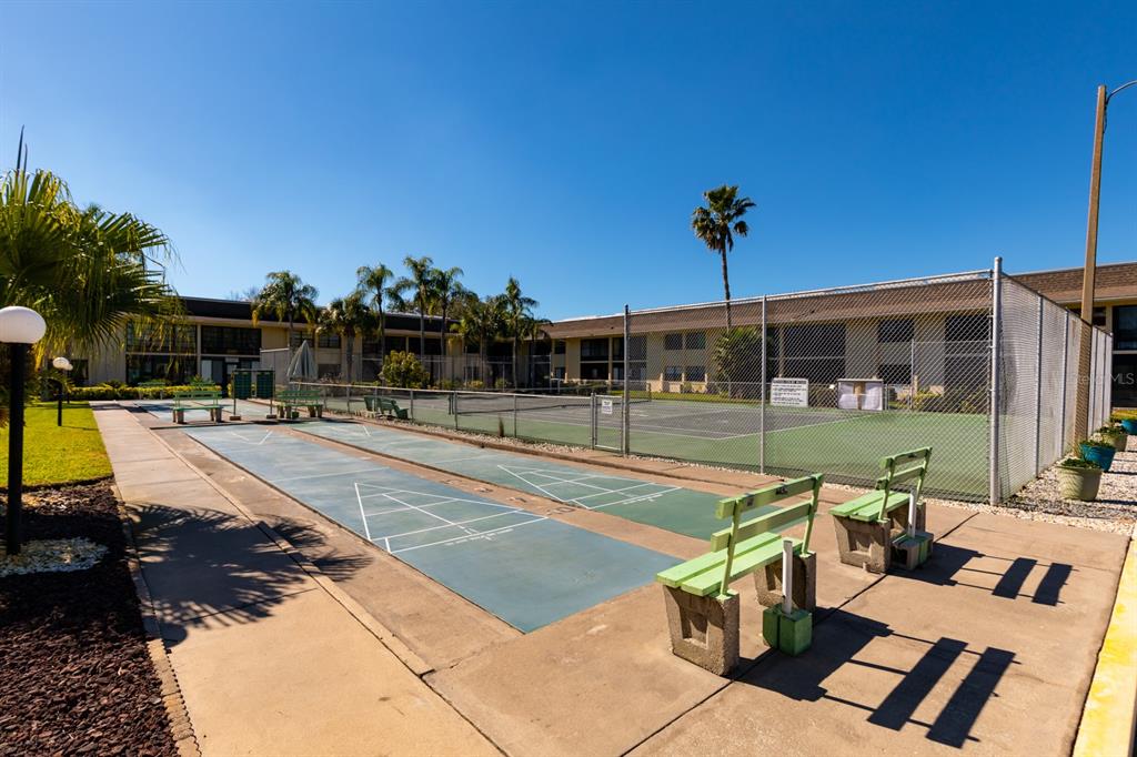 12300 Vonn Road, Unit 6303 Largo, FL 33774 - Photo 33 of 36 a view of a swimming pool with seating area