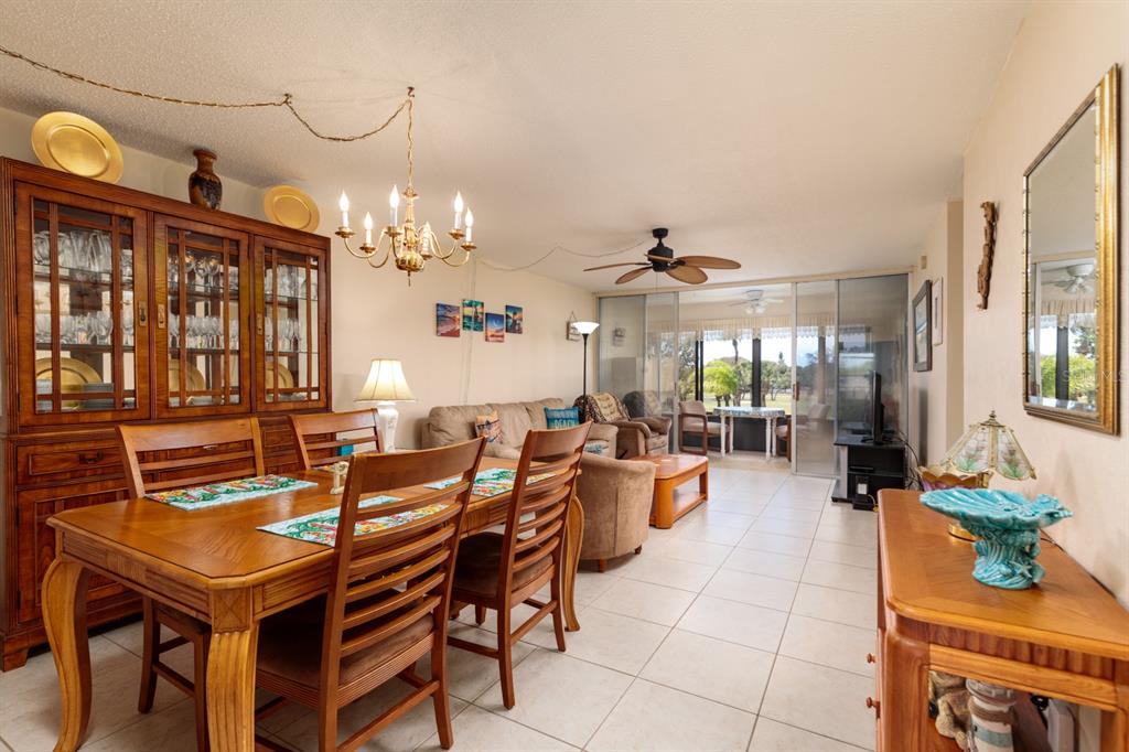 12300 Vonn Road, Unit 6303 Largo, FL 33774 - Photo 8 of 36 a view of a dining room with furniture and chandelier