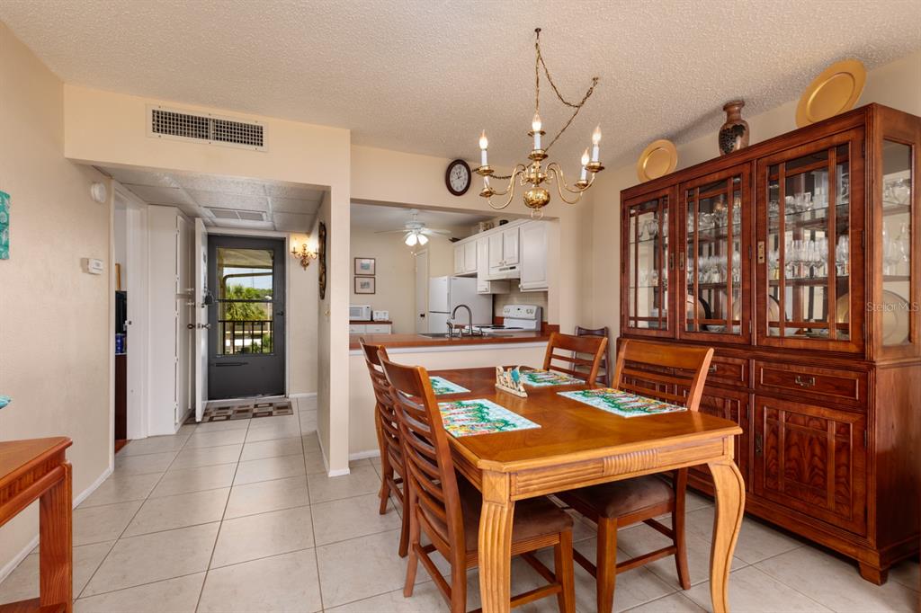 12300 Vonn Road, Unit 6303 Largo, FL 33774 - Photo 9 of 36 a view of a dining room with furniture and window