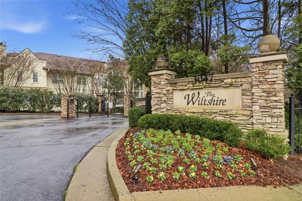 3047 Lenox Road Northeast, Unit 1108 Atlanta, GA 30324 - Photo 2 of 32 a sign board with buildings in the background