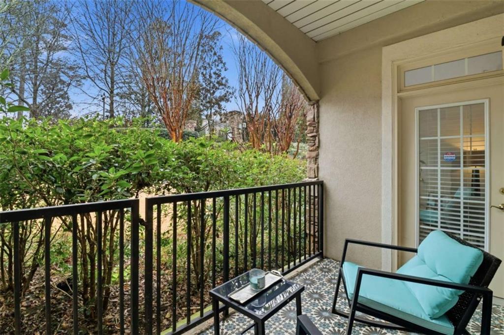 3047 Lenox Road Northeast, Unit 1108 Atlanta, GA 30324 - Photo 21 of 32 a view of a two chairs and table in the balcony