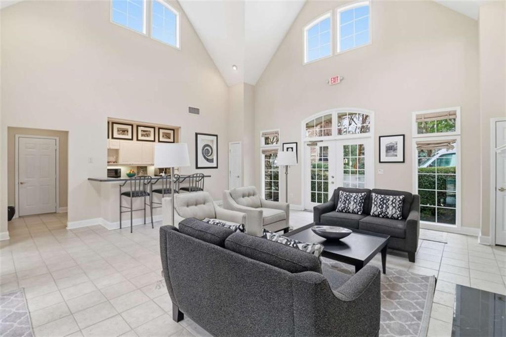 3047 Lenox Road Northeast, Unit 1108 Atlanta, GA 30324 - Photo 26 of 32 a living room with furniture and a table