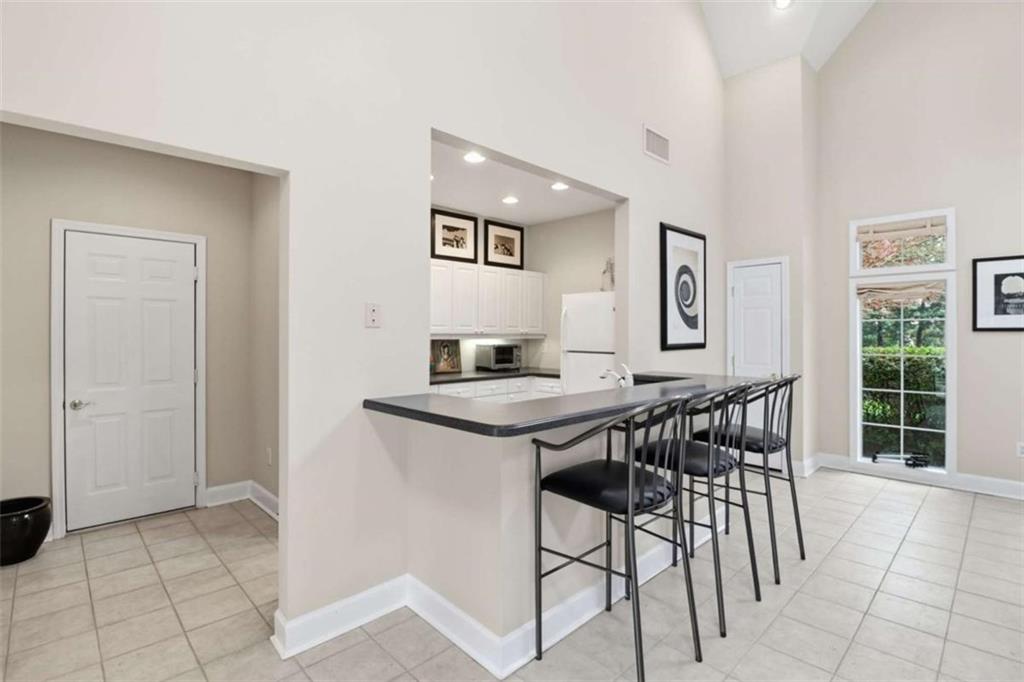 3047 Lenox Road Northeast, Unit 1108 Atlanta, GA 30324 - Photo 28 of 32 a view of a livingroom with furniture and window