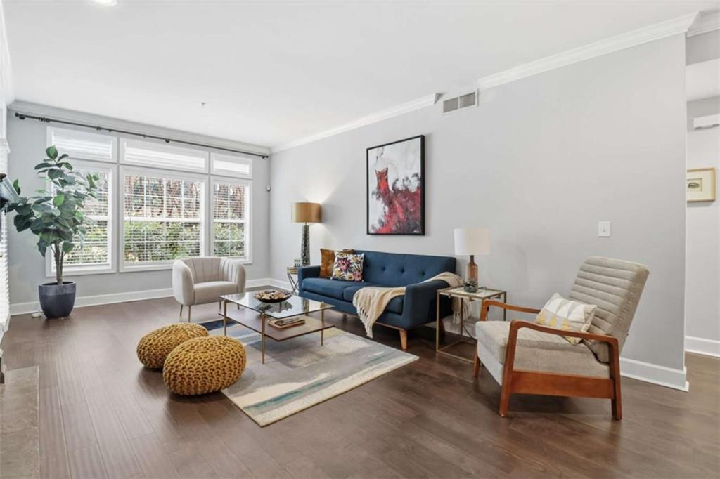 3047 Lenox Road Northeast, Unit 1108 Atlanta, GA 30324 - Photo 8 of 32 a living room with furniture and a large window
