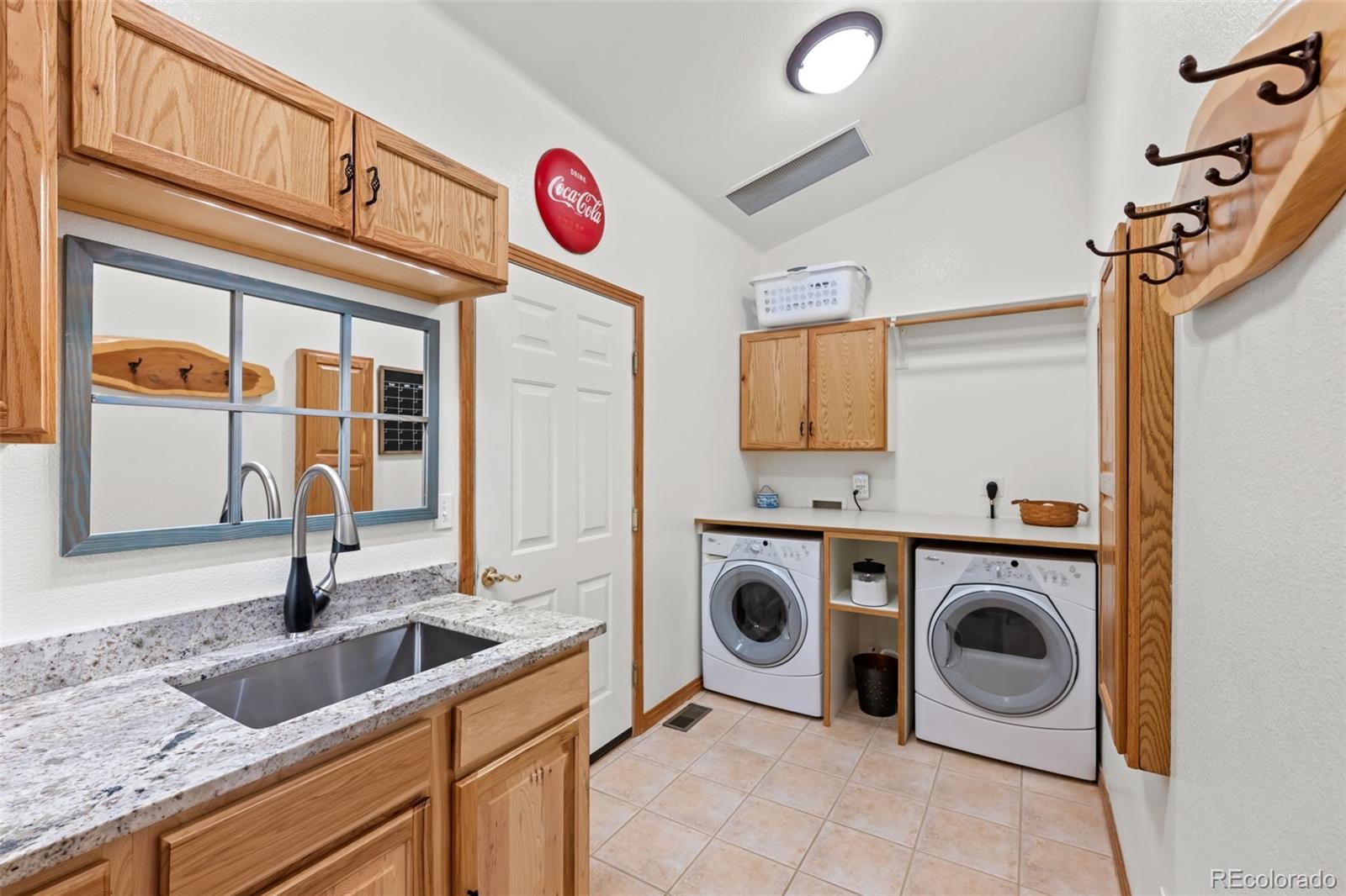 44 Forest Ridge Circle Bailey, CO 80421 - Photo 20 of 50 a utility room with sink dryer and washer