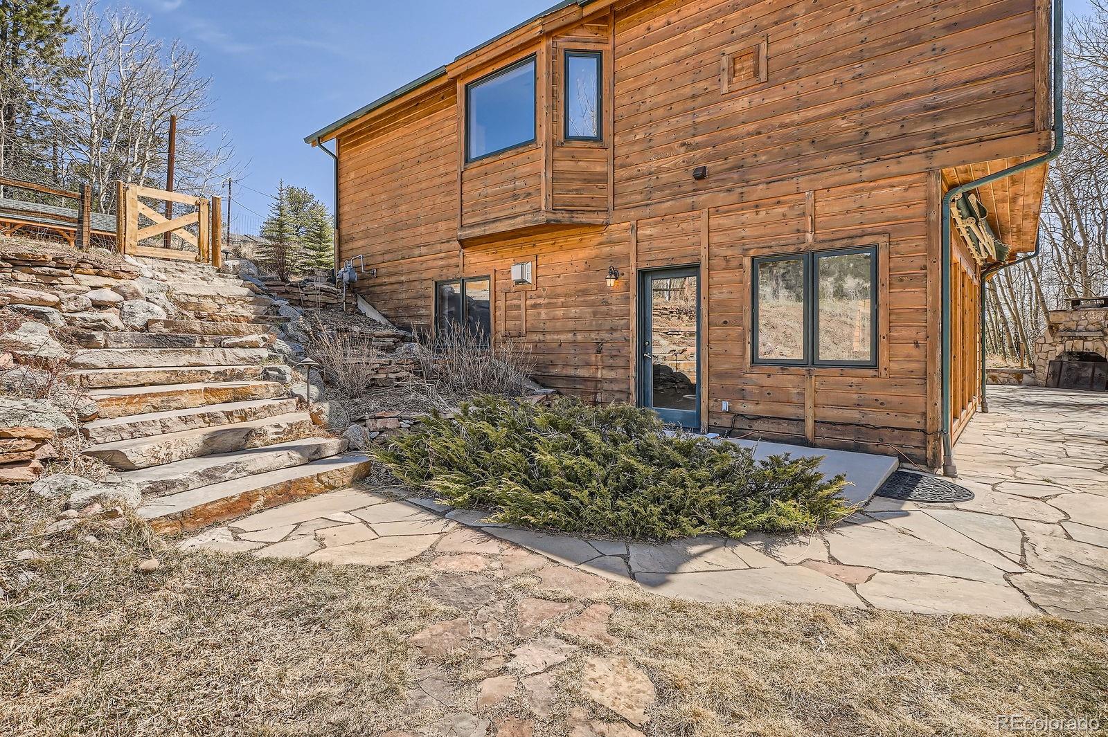 44 Forest Ridge Circle Bailey, CO 80421 - Photo 27 of 50 a view of a backyard with pathway