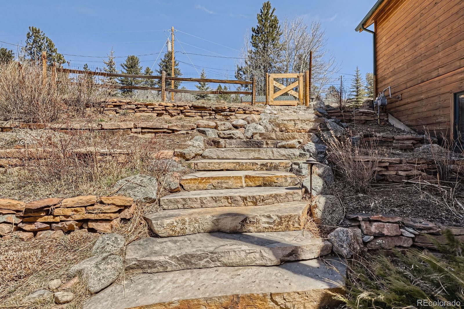 44 Forest Ridge Circle Bailey, CO 80421 - Photo 29 of 50 a view of parking area and building