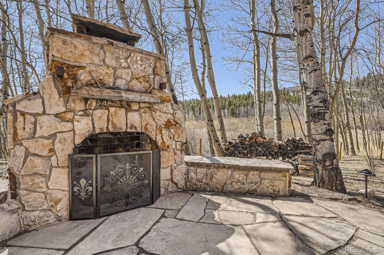 44 Forest Ridge Circle Bailey, CO 80421 - Photo 36 of 50 a view of entrance gate of building and trees