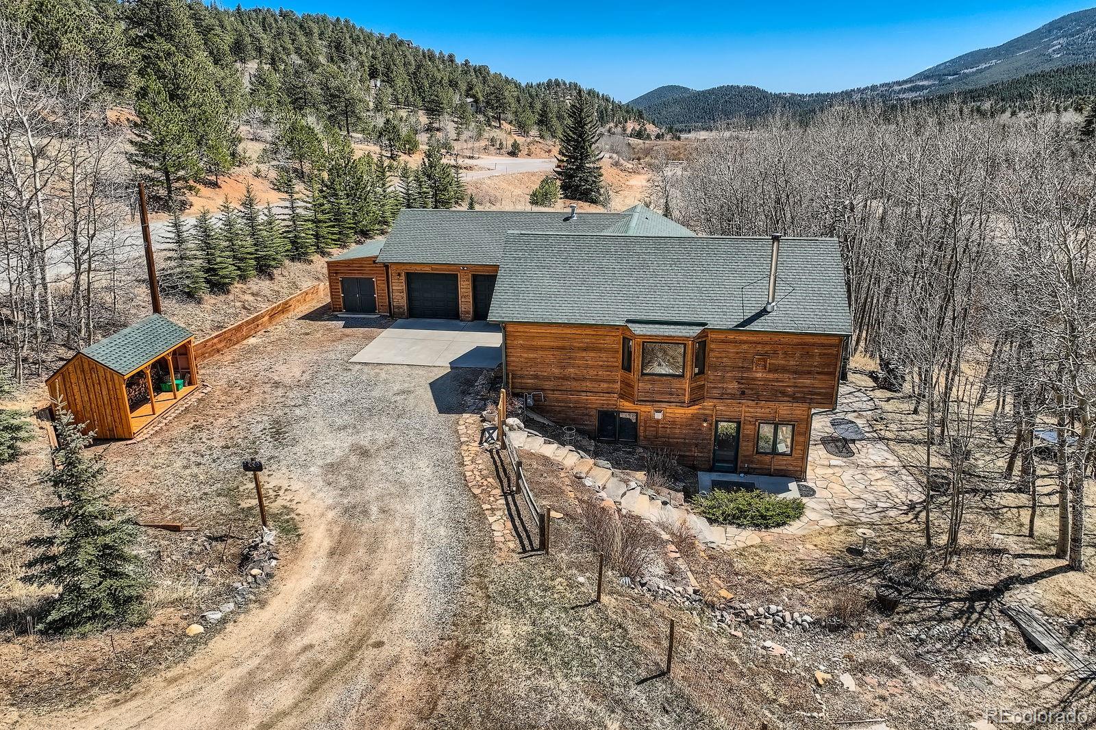 44 Forest Ridge Circle Bailey, CO 80421 - Photo 41 of 50 a aerial view of a house with a yard