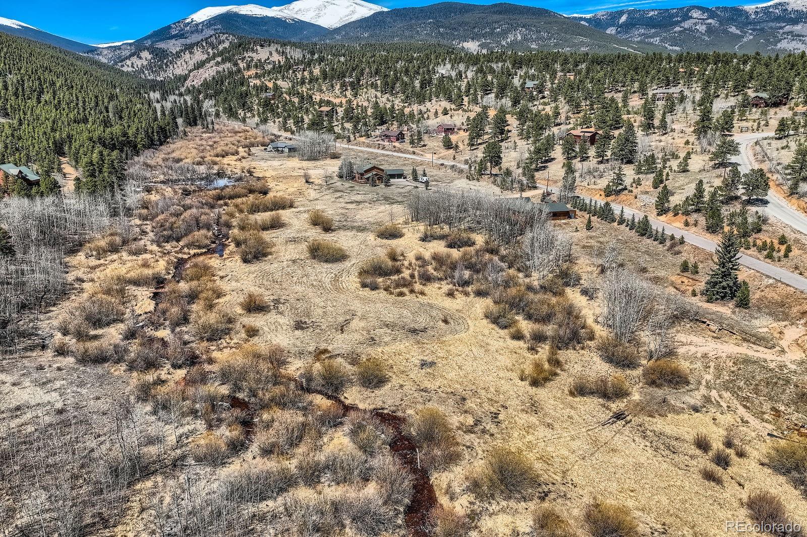 44 Forest Ridge Circle Bailey, CO 80421 - Photo 44 of 50 a view of a field with mountains in the background