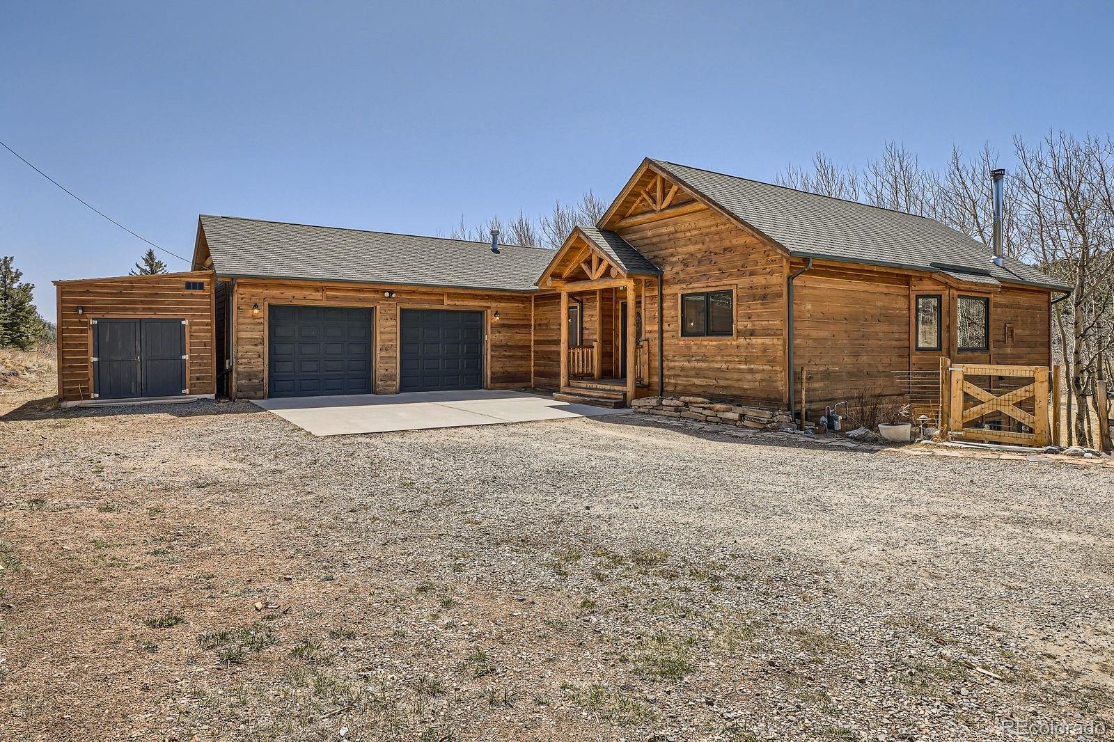 44 Forest Ridge Circle Bailey, CO 80421 - Photo 5 of 50 a view of a house with a yard