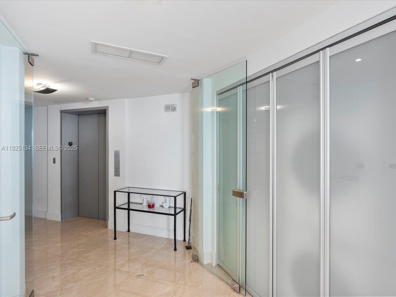 1331 Brickell Bay Drive, Unit 1811 Miami, FL 33131 - Photo 22 of 30 a bathroom with a shower and a view of bathroom