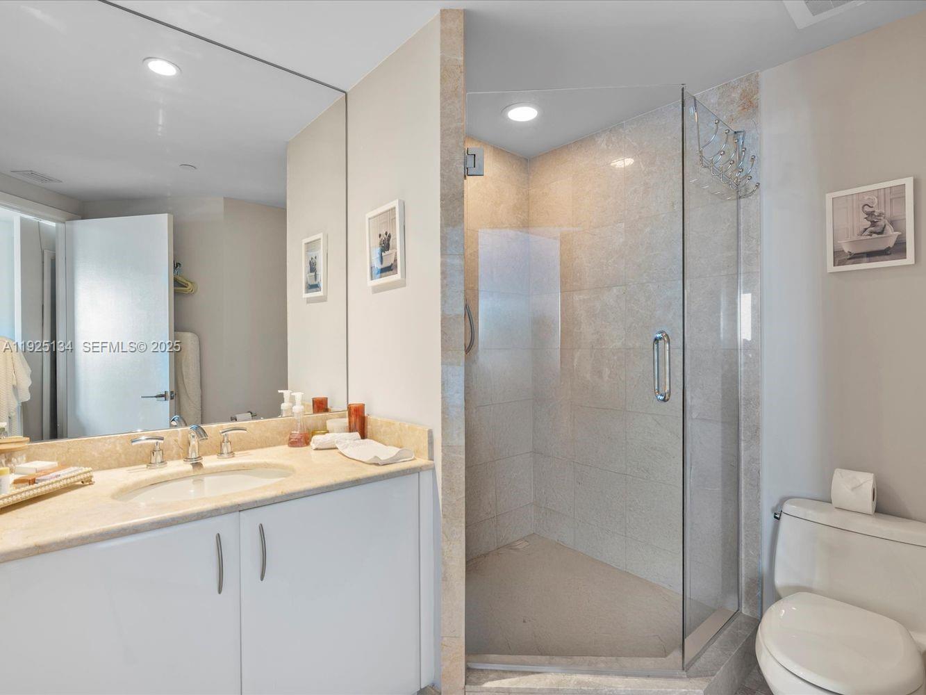 1331 Brickell Bay Drive, Unit 1811 Miami, FL 33131 - Photo 26 of 30 a bathroom with a sink toilet and shower