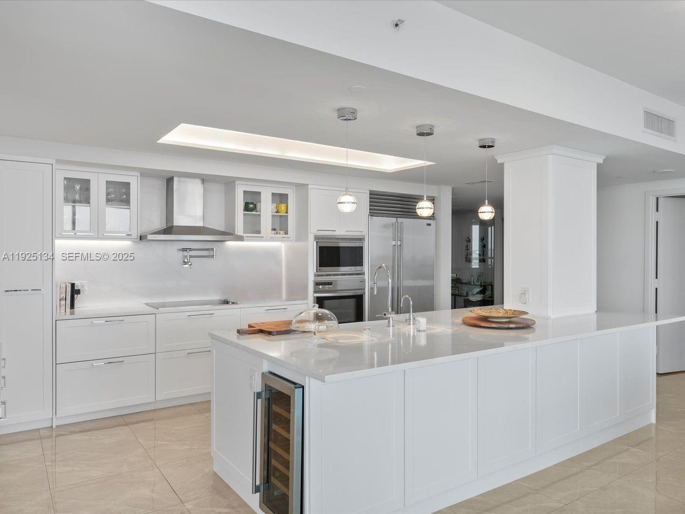 1331 Brickell Bay Drive, Unit 1811 Miami, FL 33131 - Photo 6 of 30 a kitchen with stainless steel appliances granite countertop a sink and cabinets