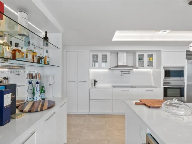 a kitchen with a sink and refrigerator