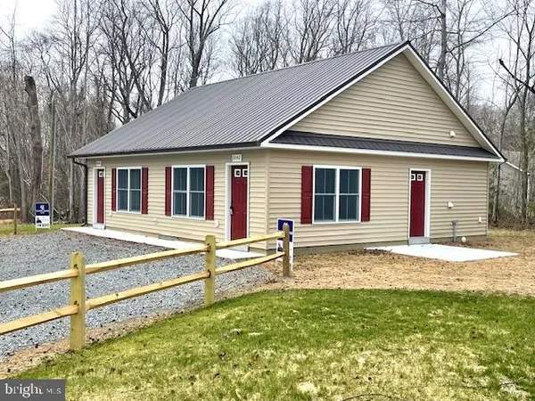 a house that has a large pool in front of it