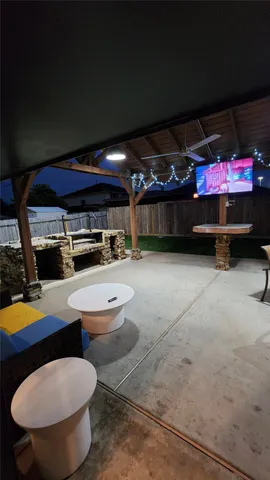 a room with furniture and flat screen tv