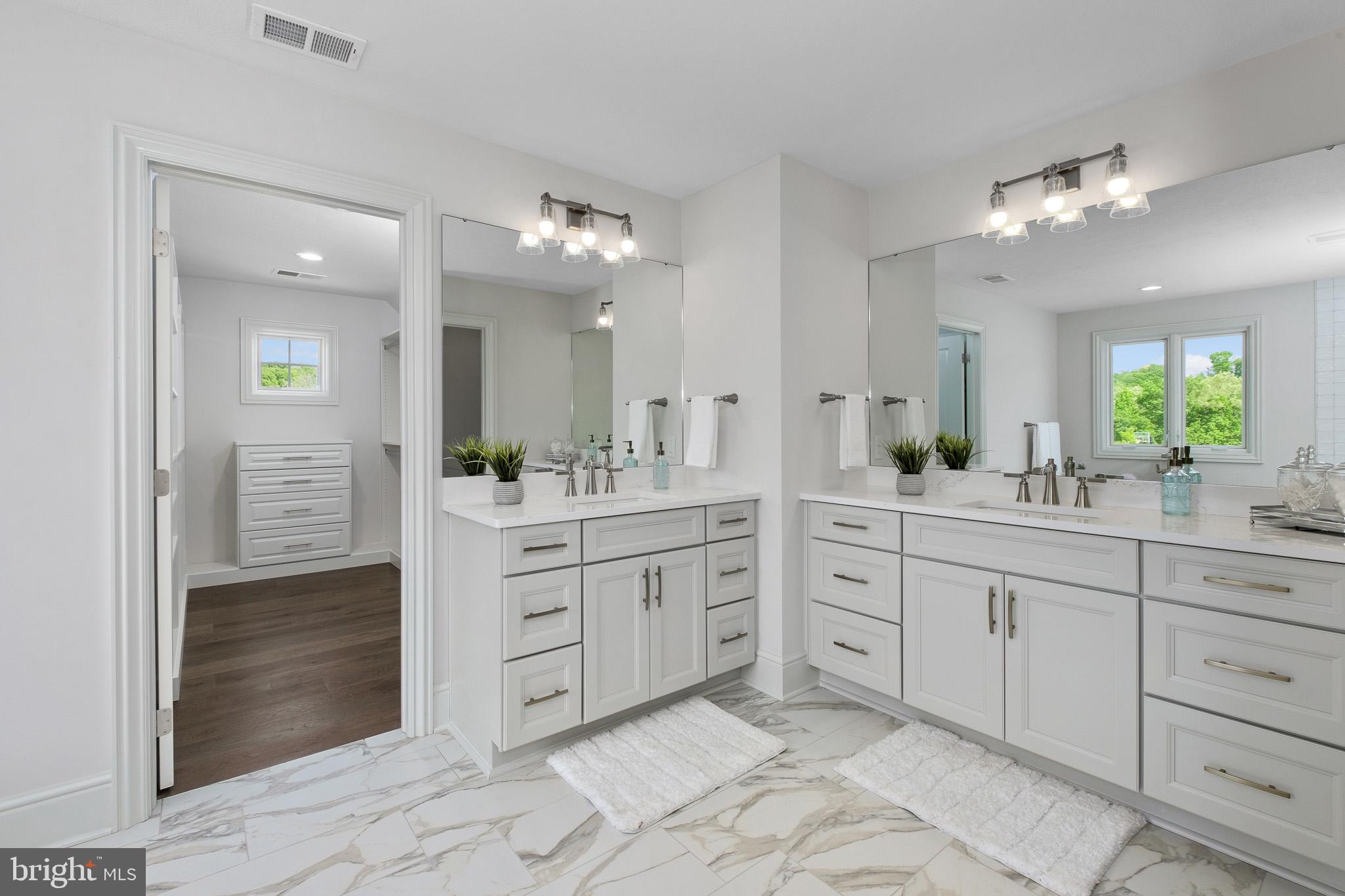355 Bronson Circle, Unit R1D Collegeville, PA 19426 - Photo 28 of 47 a spacious bathroom with a granite countertop sink mirror and a