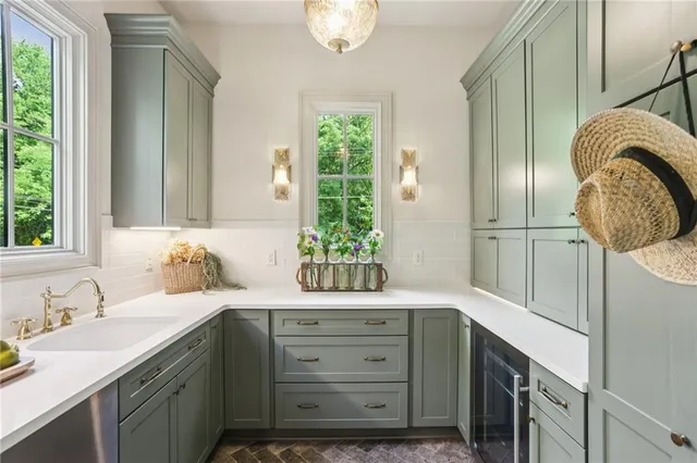 a bathroom with a granite countertop sink a vanity and a mirror