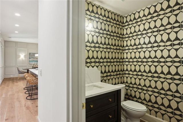 a bathroom with a toilet and a shower curtain