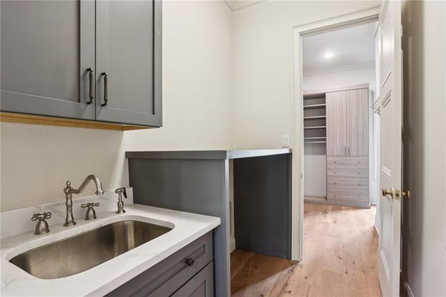 a kitchen with a sink and cabinets