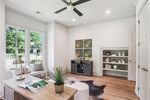 a living room with furniture window and wooden floor