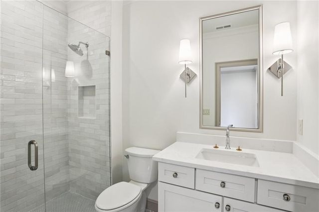 a bathroom with a toilet sink a shower and