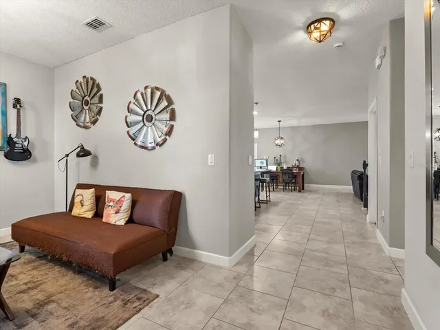 a living room with furniture and a table