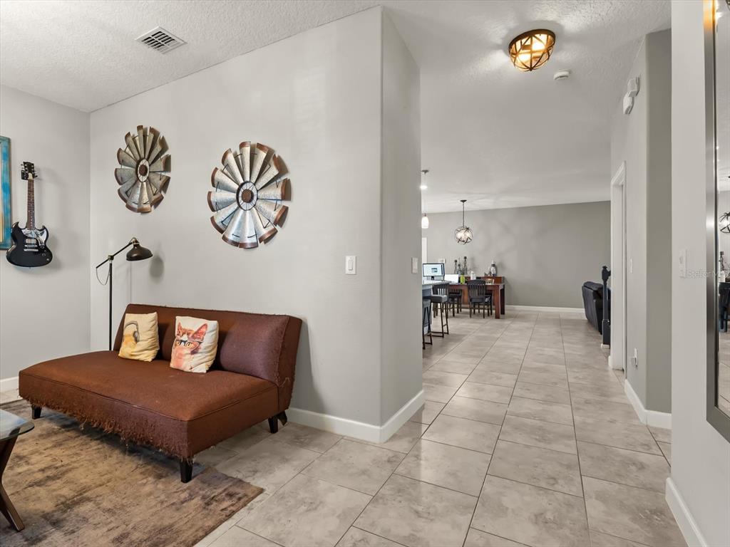 15433 Porter Road Winter Garden, FL 34787 - Photo 12 of 46 a living room with furniture and a table